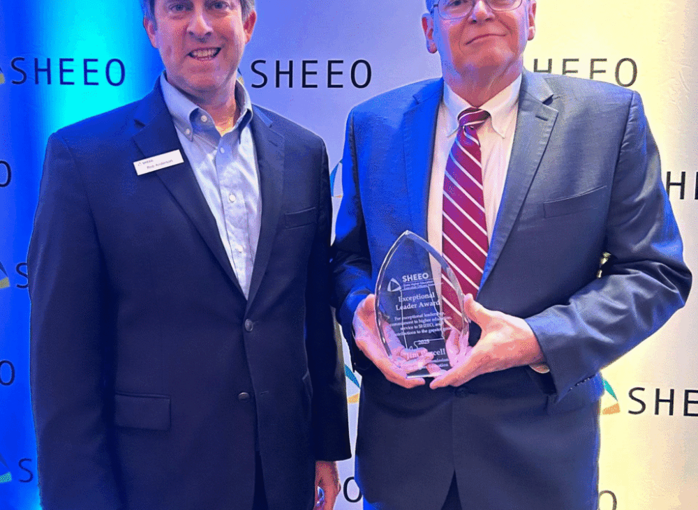Two education leaders posing with an award at the SHEEO leadership recognition event.